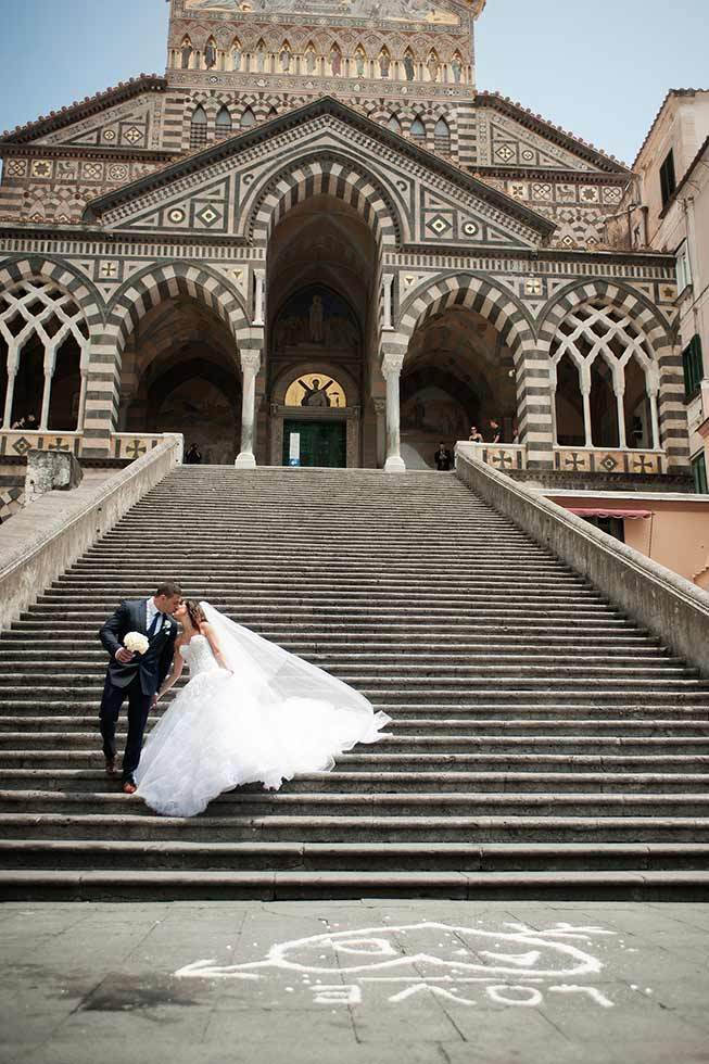 Bride and groom in front of the Amalfi Duomo